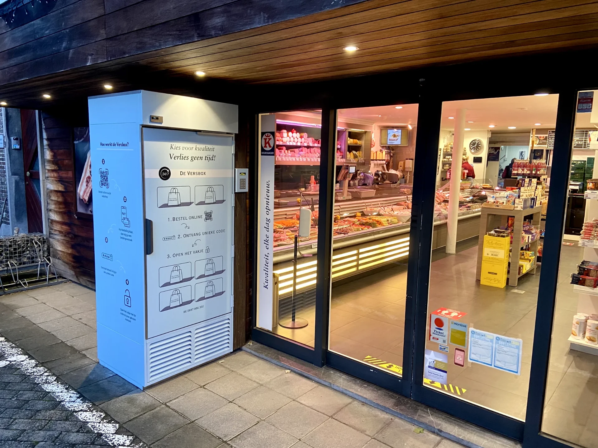 Versbox installed on the front of a butcher's shop — 24/7 pickup available